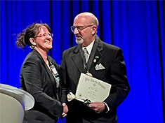 Dennis Kelly congratulated by Susan